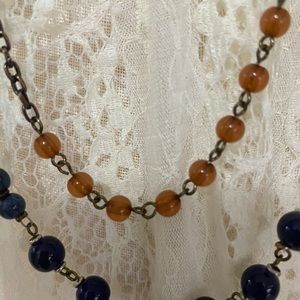 Small beads of blue and rust long necklace double strand